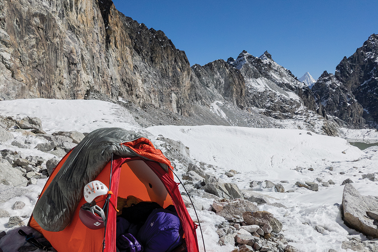Camping in alpine technical tent on Kyajo-Ri summit